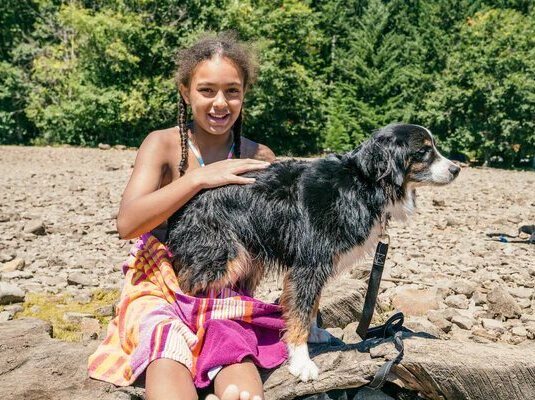 Family choosing an Australian Shepherd puppy.